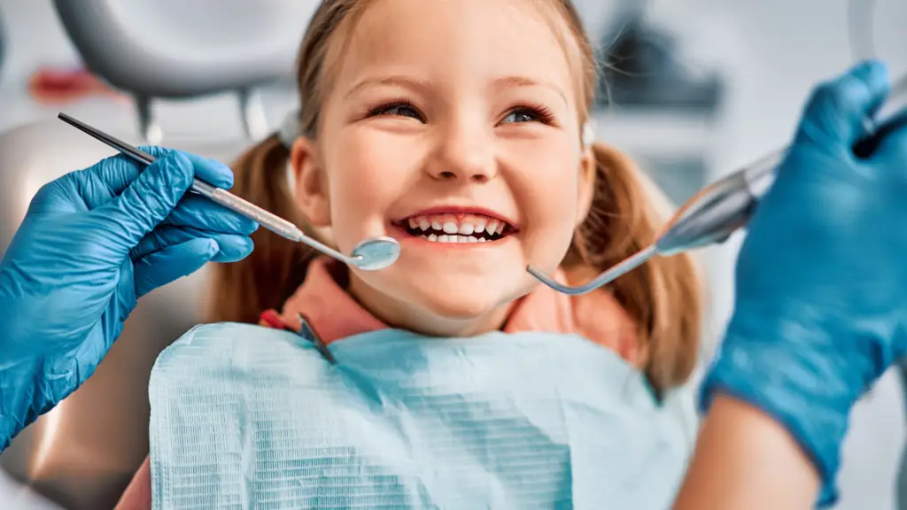 Parent and child at a back-to-school dental checkup in Toronto